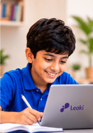 A student smiling as he studies on a laptop